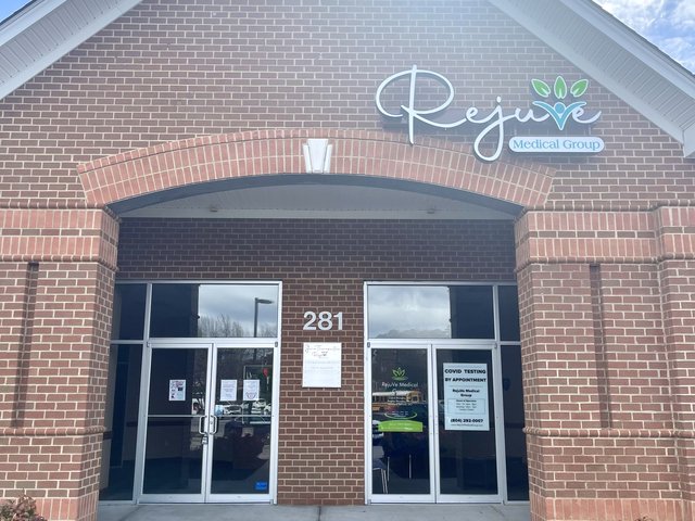The entrance of a RejuVe Medical Group office, with the RejuVe sign over the doors